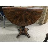 A William 1V mahogany Sutherland table the twin fl