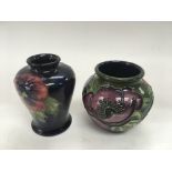 Two small Moorcroft vases, one decorated with pans