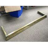 A brass fender, approx 131cm.