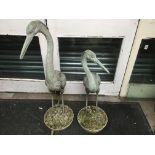 A pair of garden ornaments in the form of storks