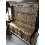 An oak dresser. Size approx 149x190x47cm