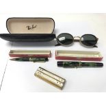 A pair of Ray-Ban sunglasses with original case. A