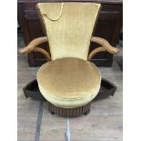 An unusual low sewing chair with pull out drawers