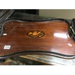 An Edwardian mahogany tray with brass handles