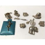 10 large silver charms. Weight approx 32.40g