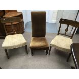 A pair of open back chairs and a low chair