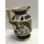A 19th century Majolica jug decorated with a boy w
