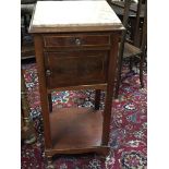 An Edwardian inlaid and marble topped bedside cabi