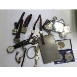A bag containing mixed watches, coins and white me
