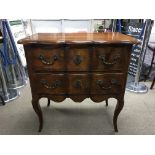 A two drawer mahogany cabinet by Theodore Alexande