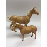 Two Beswick horses comprising two matt finish Palo