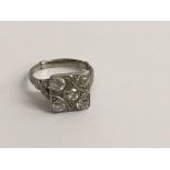 A Art Deco platinum ring inset with five diamonds size k