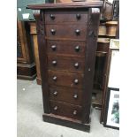 A Victorian mahogany wellington chest fitted with seven drawers on a plinth base