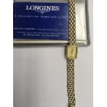 A 9 ct Gold Longines ladies wristwatch the square