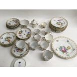 A collection of Dresden cups and saucers decorated