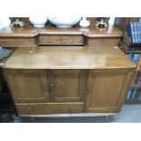 An Ercol mid elm sideboard with cupboards and drawer Approx r50x1.14cmx82cm high