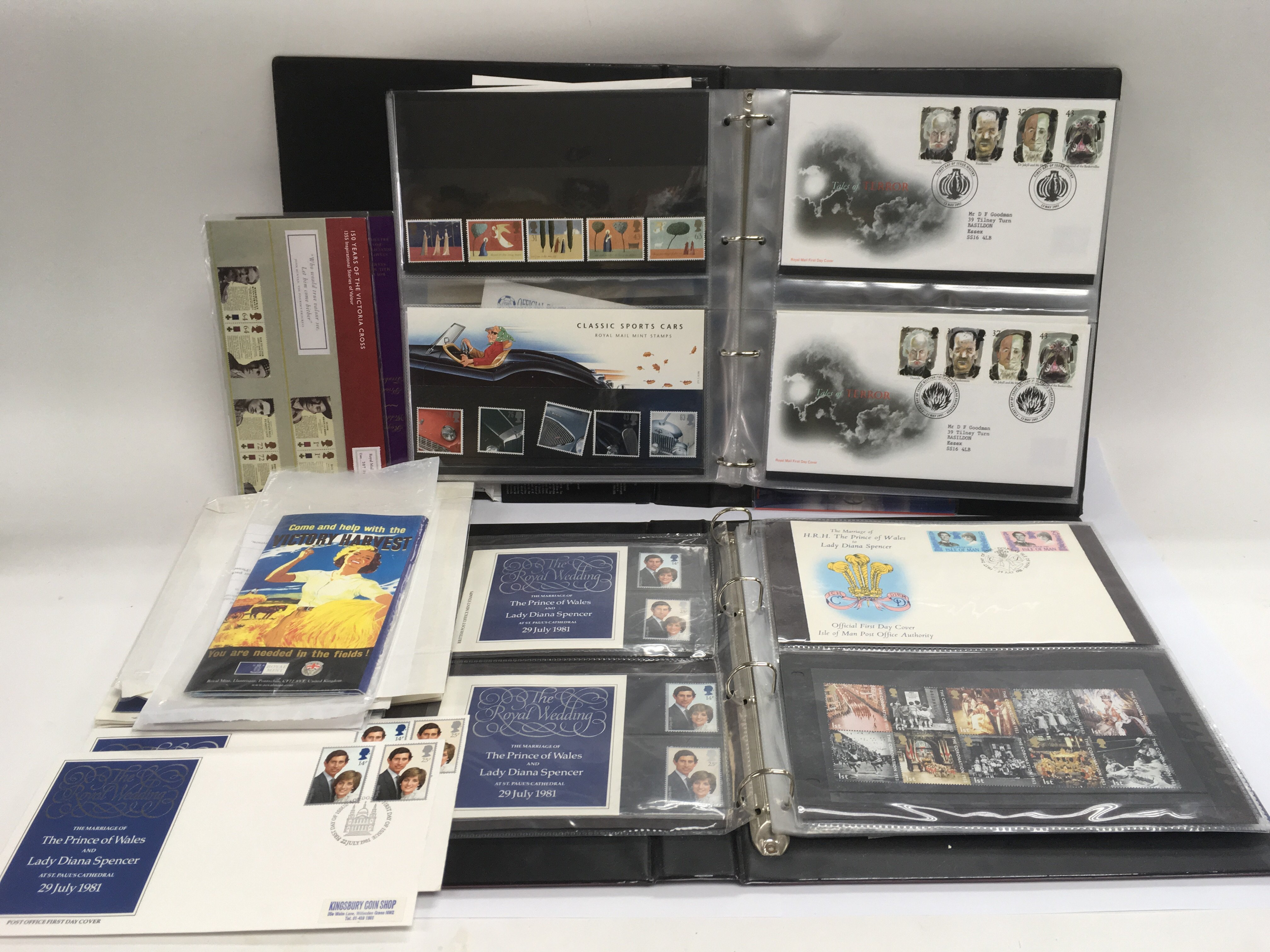 Two binders containing first day covers and stamps