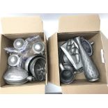 Two boxes of pewter items.