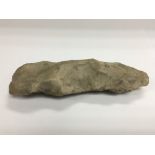 A piece of flint, possibly for use as an axe head.