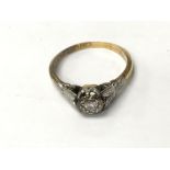 An 18ct gold and platinum diamond ring. Weight app