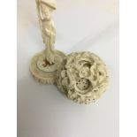 A canton ivory puzzle ball on figured stand 24 cm