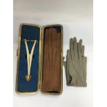 An Edwardian glove case and contents.