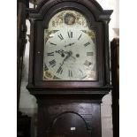 A 8 day long case clock the arched painted dial wi