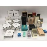 A collection of boxed perfumes including Chanel No