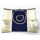 A Mikimoto pearl necklace with matching pearl brac