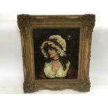 A gilt framed oil on canvas of a young lady in Vic