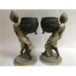 A pair of spelter figures in the form of Eastern b