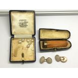 A cased amber and 18ct gold mounted cheroot holder