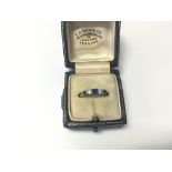 An 18ct gold diamond and sapphire ring. Weight app