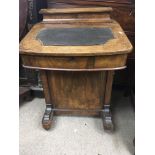 A Victorian walnut davenport fitted with four draw