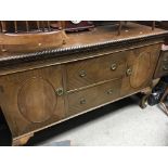 A Mahogany sideboard with drawers and cupboards on