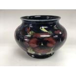 A Moorcroft bowl in Pansy pattern, approx height 1