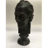 A bronze bust of Voltaire, approx 23cm.