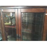 A Modern Quality Oak Display cabinet with lead lig