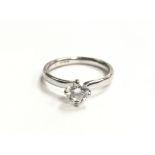 A ladies small 18ct white gold ring set with a sin