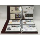 A box of binders containing first day covers, pres