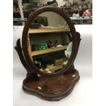 A mahogany dressing table mirror.