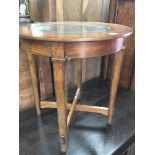 An oak Occasional table with a round top inset wit