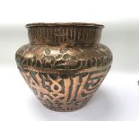 A hand hammered copper jardiniere, possibly middle