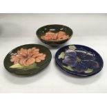 Three Moorcroft pin dishes all with floral decorat