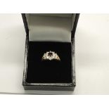 A 9ct sapphire cluster ring.Approx size K