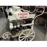 Dairy milk cart with milk churn and various milk m