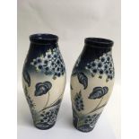 A large and impressive pair of tube lined vases de