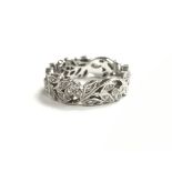 A small ladies 18ct white gold ring of open folate