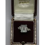 An 18ct white gold set with a square cut diamond,