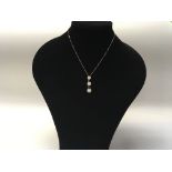A modern design 18ct white gold necklace set with